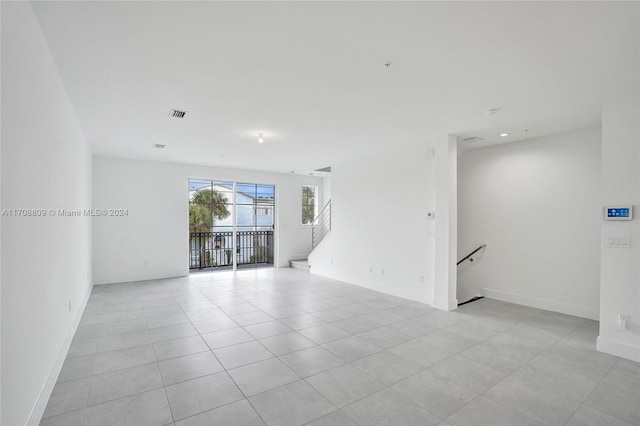 spare room with light tile patterned flooring