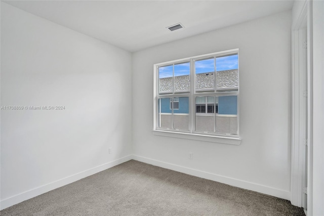 empty room featuring carpet flooring