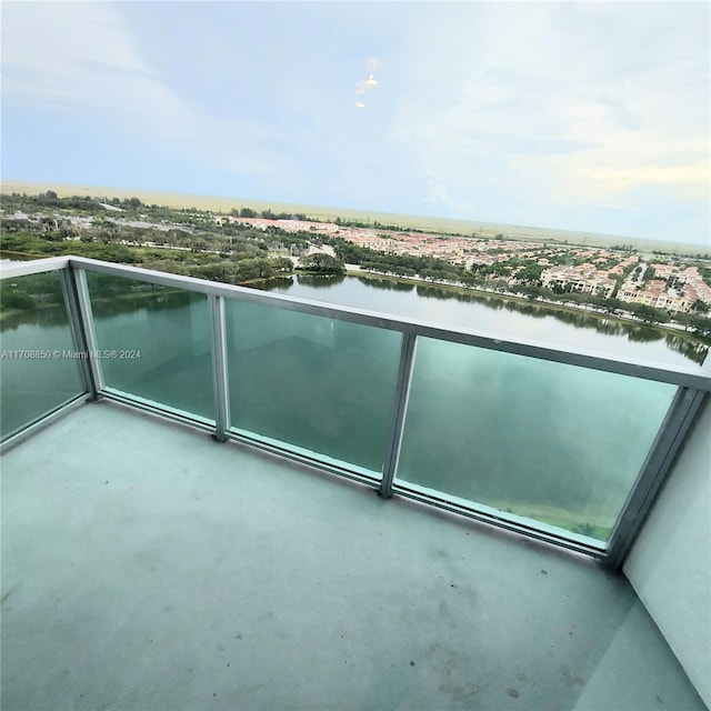 balcony featuring a water view