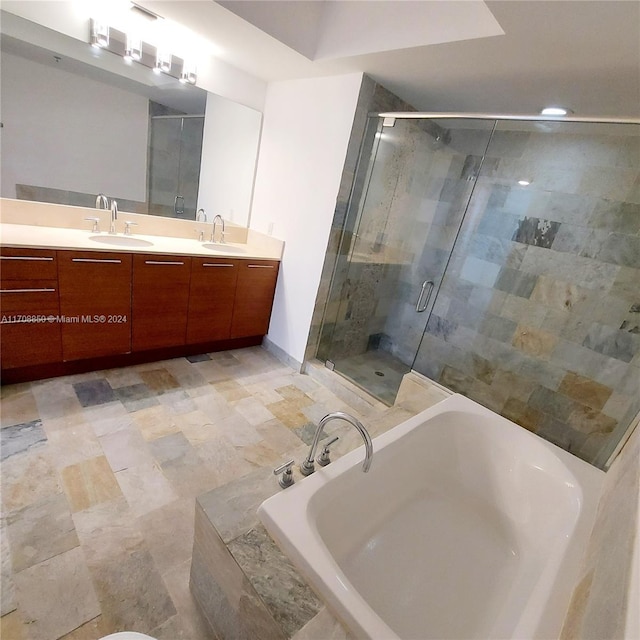 bathroom featuring vanity and plus walk in shower