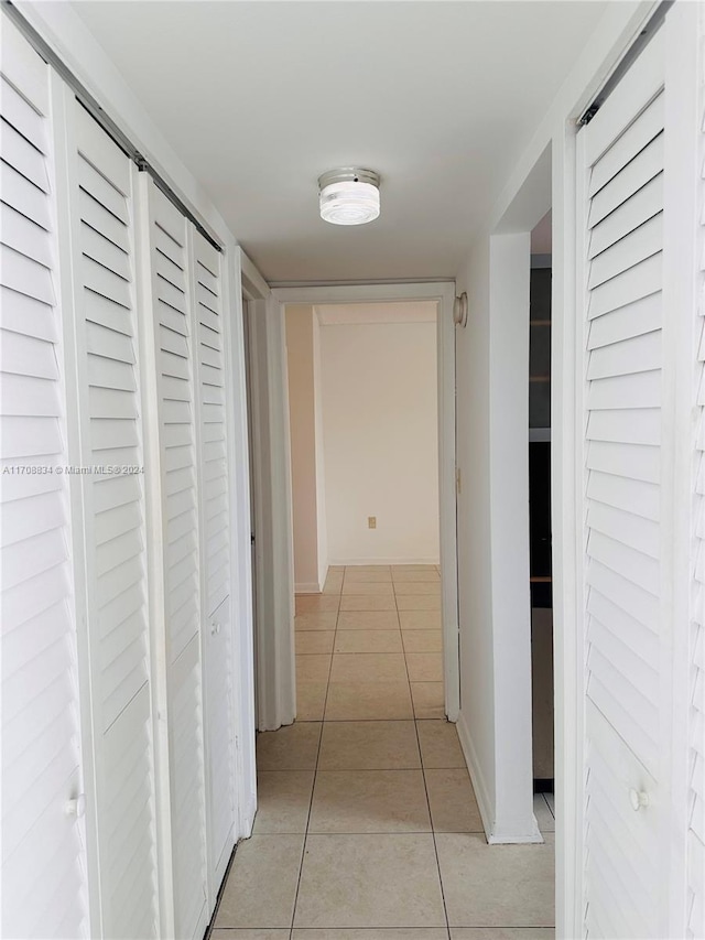 hallway with light tile patterned flooring