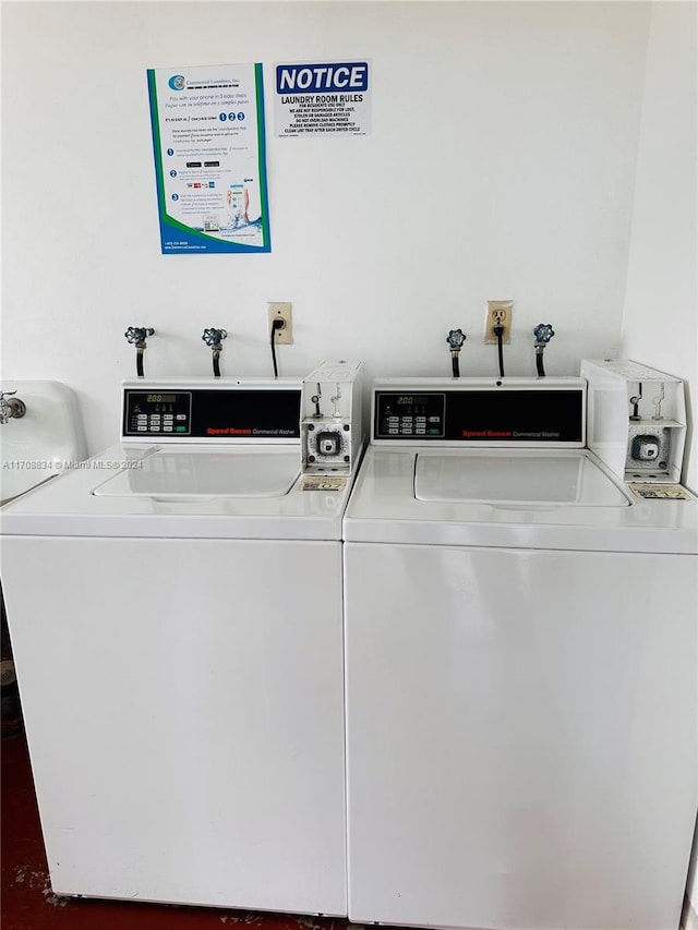 laundry room with separate washer and dryer