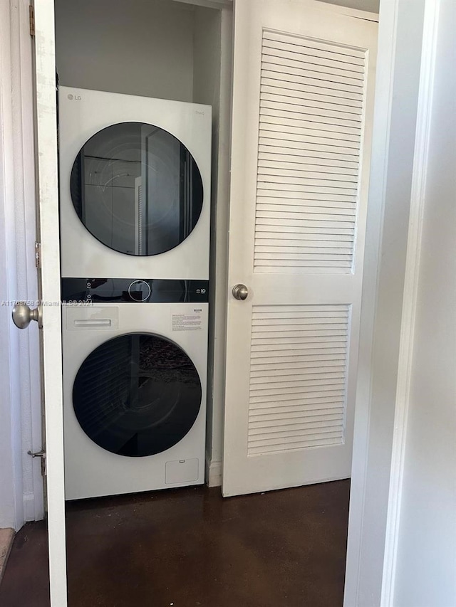 laundry room with stacked washing maching and dryer