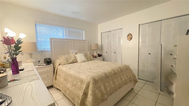 tiled bedroom with two closets