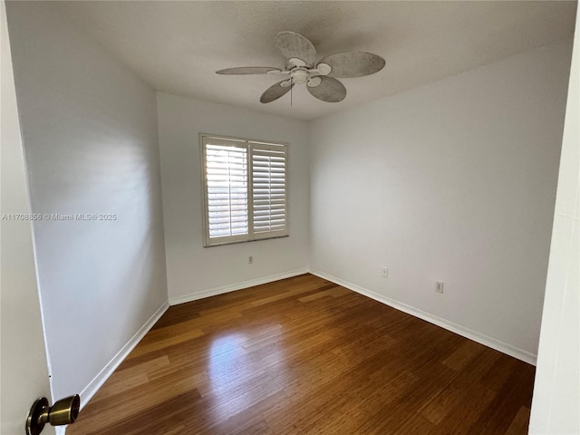 spare room with wood-type flooring and ceiling fan