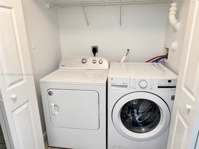 washroom featuring independent washer and dryer