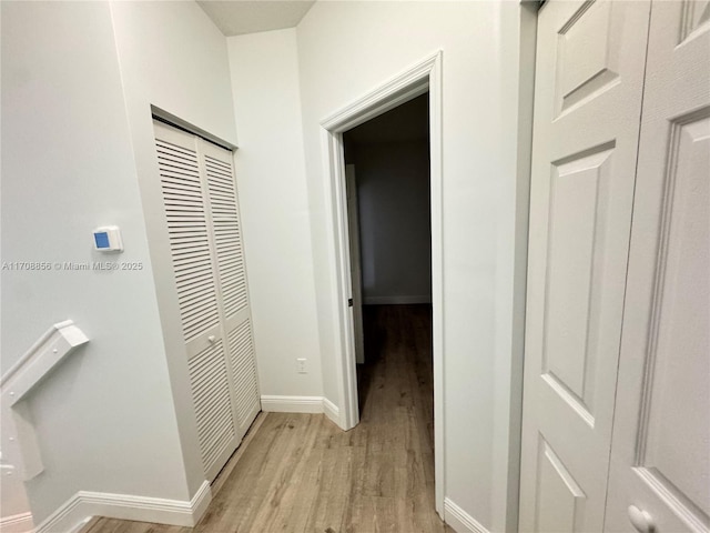 hallway featuring light hardwood / wood-style flooring