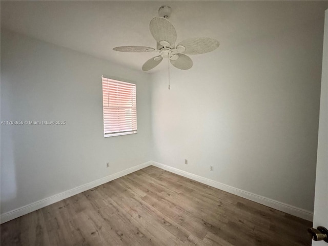 spare room featuring light hardwood / wood-style floors and ceiling fan