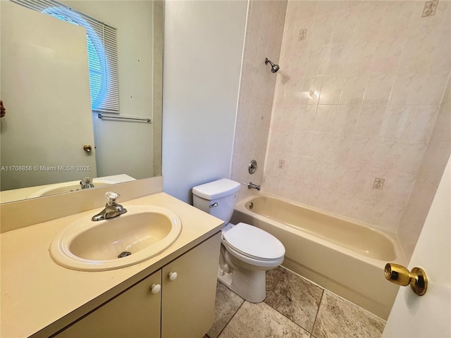 full bathroom featuring vanity, tub / shower combination, and toilet