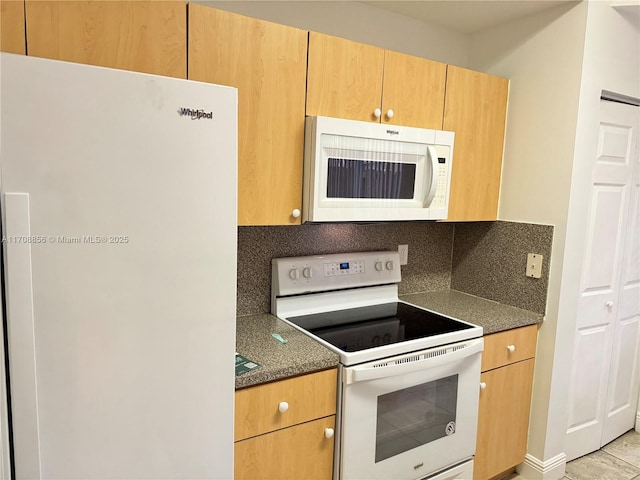 kitchen featuring tasteful backsplash, white appliances, and light tile patterned floors