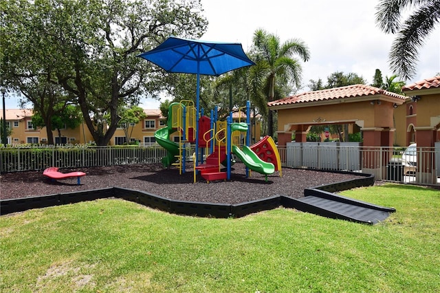 view of play area featuring a lawn