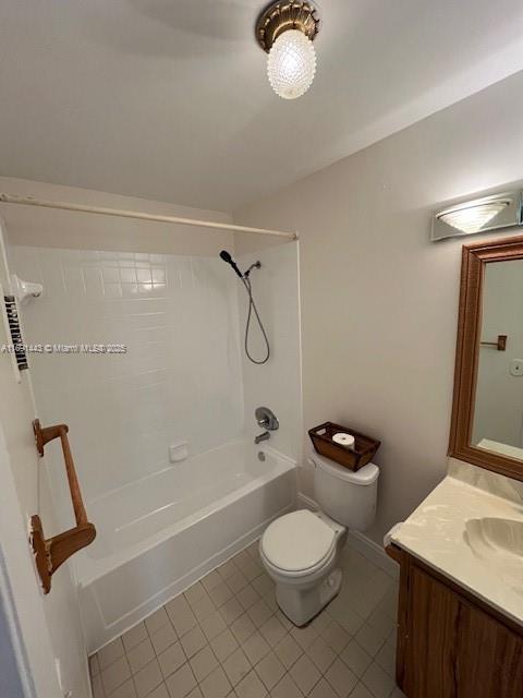 full bathroom featuring tile patterned floors, vanity, toilet, and bathing tub / shower combination