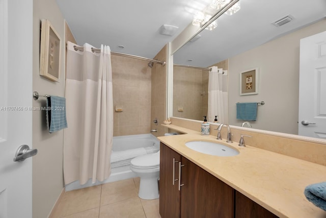 full bathroom featuring tile patterned flooring, shower / bath combo, vanity, and toilet