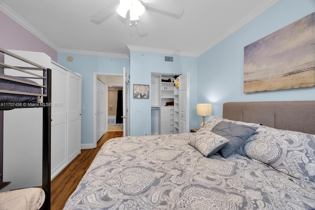 bedroom with ceiling fan, dark hardwood / wood-style flooring, and ornamental molding