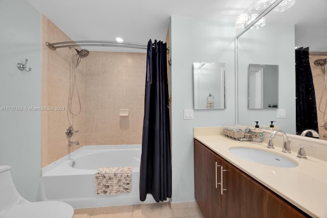 full bathroom featuring toilet, shower / tub combo, vanity, and tile patterned floors