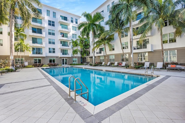 view of swimming pool with a patio area