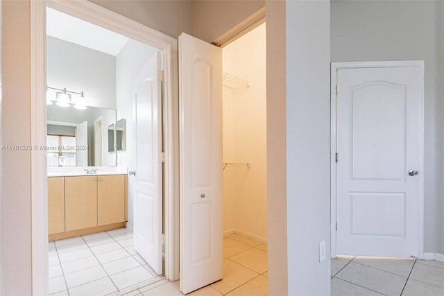 bathroom with tile patterned floors and vanity