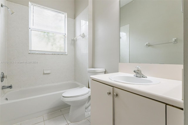 full bathroom featuring toilet, vanity, tiled shower / bath combo, and tile patterned floors