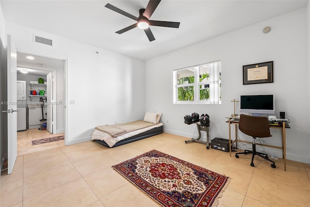 tiled bedroom featuring ceiling fan