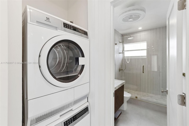 laundry room featuring stacked washing maching and dryer