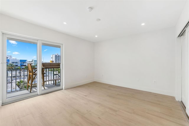 unfurnished room featuring light wood-type flooring