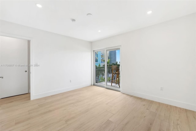 unfurnished room with light hardwood / wood-style flooring