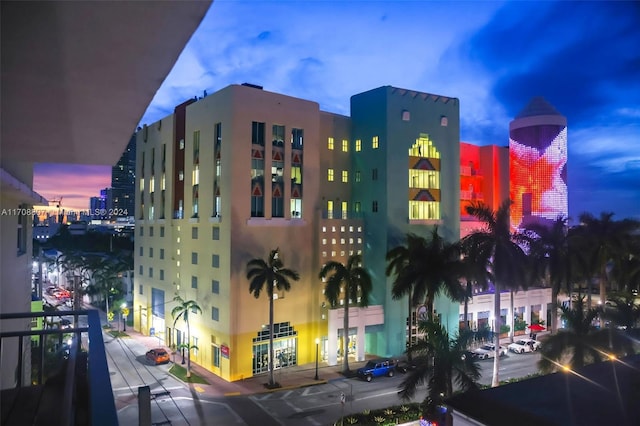 view of outdoor building at dusk