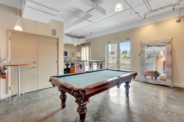 rec room with french doors, billiards, and concrete floors