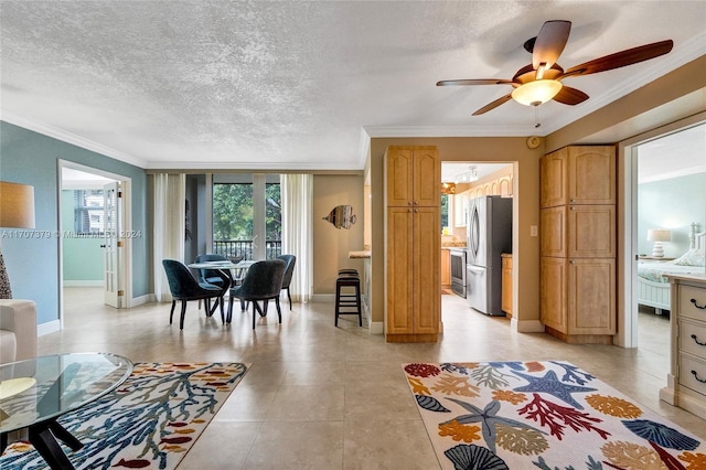 living room featuring ceiling fan, crown molding, and a textured ceiling