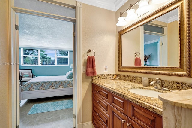 bathroom featuring tile patterned floors, vanity, and ornamental molding