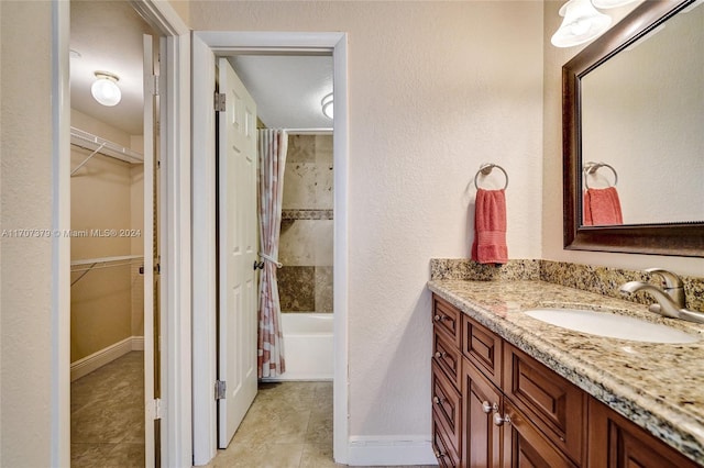 bathroom with tile patterned flooring, vanity, and shower / bath combination with curtain