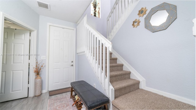 stairway with wood-type flooring