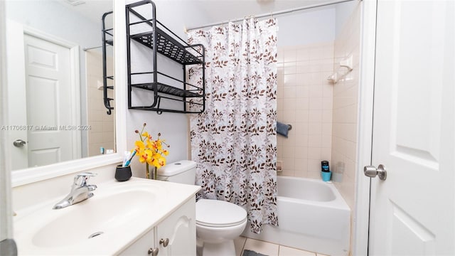 full bathroom featuring tile patterned floors, vanity, toilet, and shower / tub combo