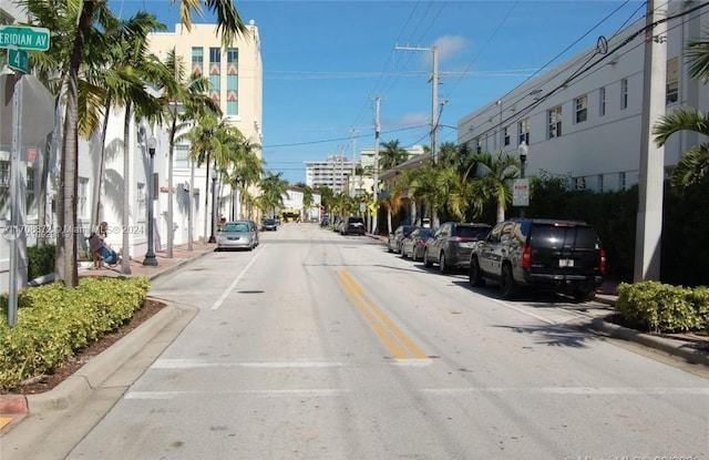 360 Meridian Ave Unit 4C, Miami Beach, FL 33139 - view of asphalt road featuring curbs, sidewalks, and street lights