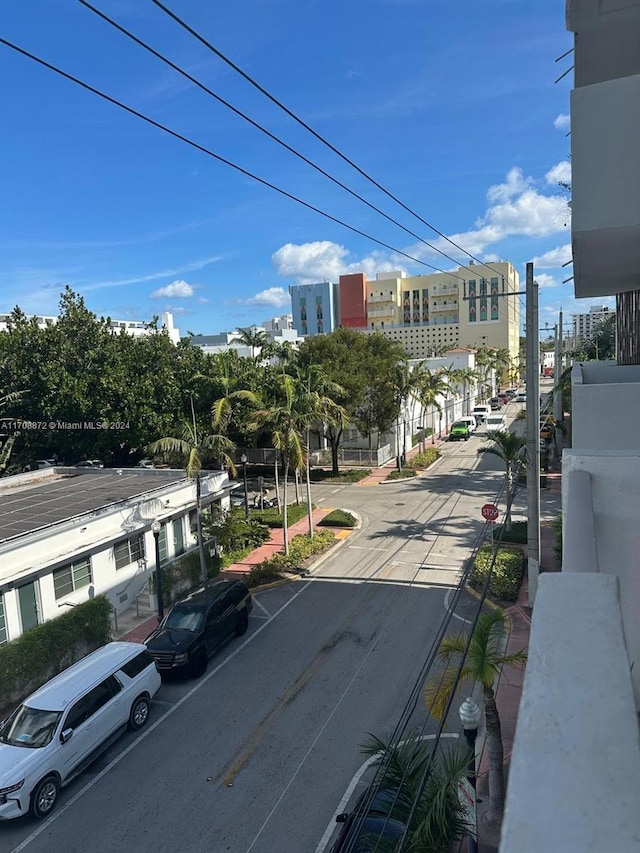 360 Meridian Ave Unit 4C, Miami Beach, FL 33139 - view of asphalt street featuring sidewalks, curbs, and traffic signs