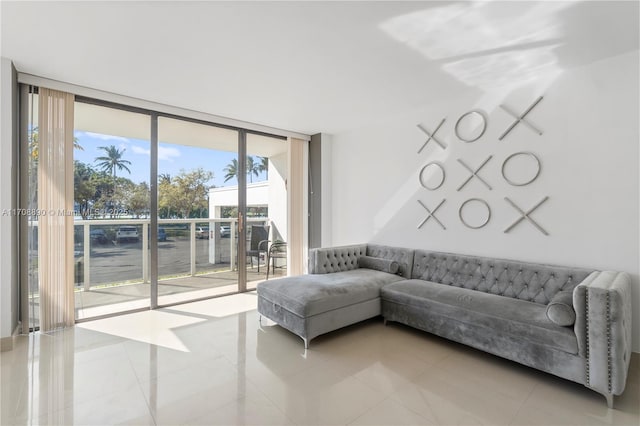 tiled living room with a wall of windows