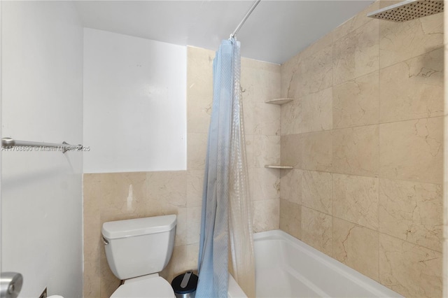 bathroom with tile walls, shower / bathtub combination with curtain, and toilet