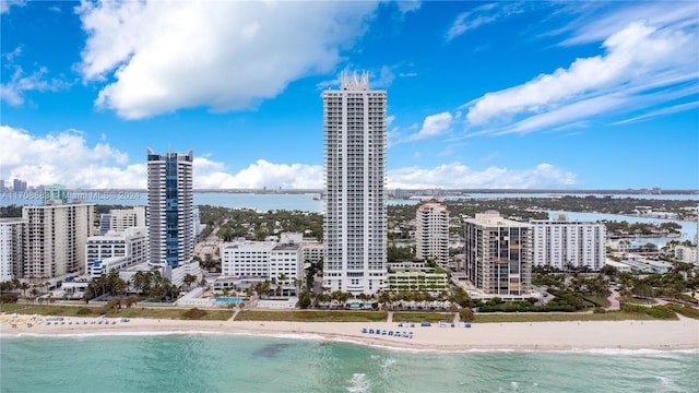 exterior space with a water view and a view of the beach