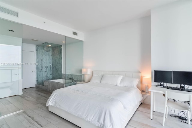 bedroom with light hardwood / wood-style flooring