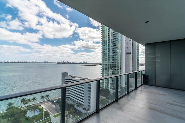 balcony featuring a water view