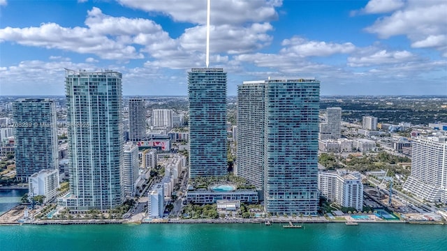 birds eye view of property featuring a water view and a city view