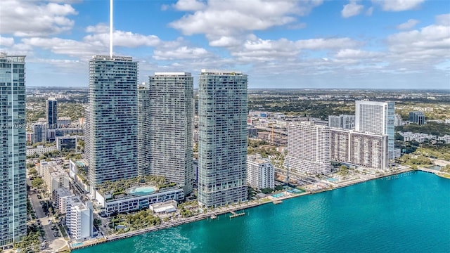 bird's eye view featuring a water view and a city view