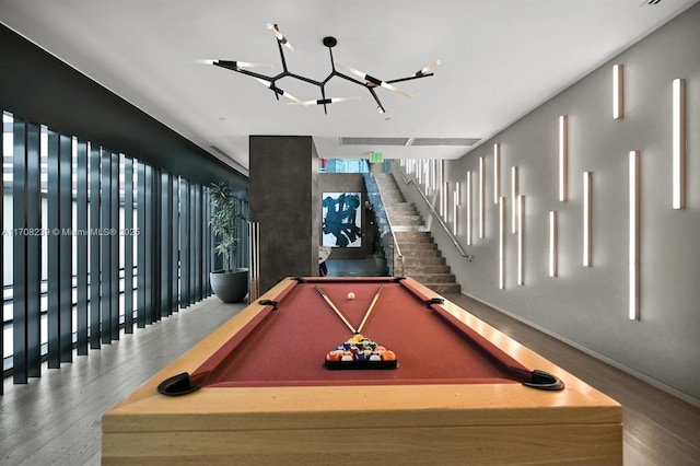 playroom with a notable chandelier, baseboards, billiards, and wood finished floors