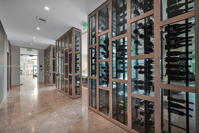 wine room with marble finish floor and visible vents