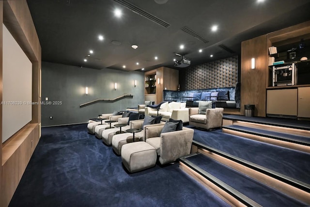 cinema room with dark carpet