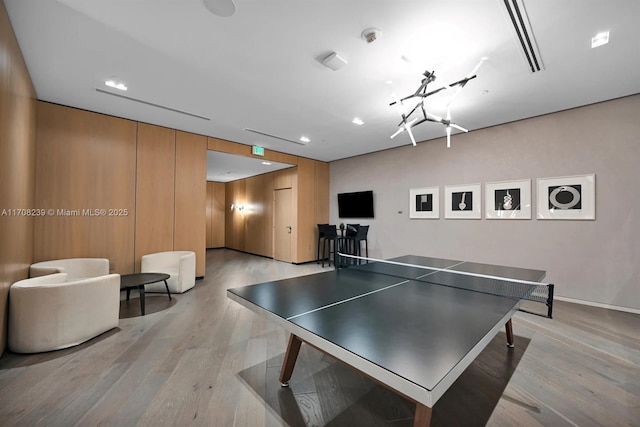 recreation room with light wood finished floors, baseboards, and recessed lighting