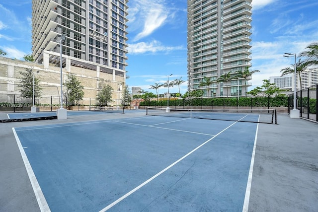 view of tennis court with fence