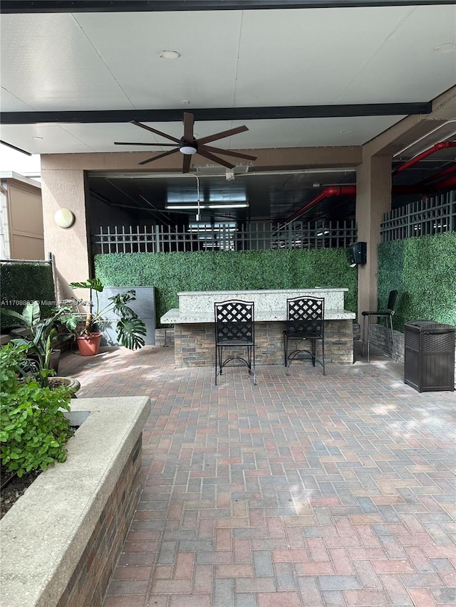 view of patio / terrace featuring an outdoor bar