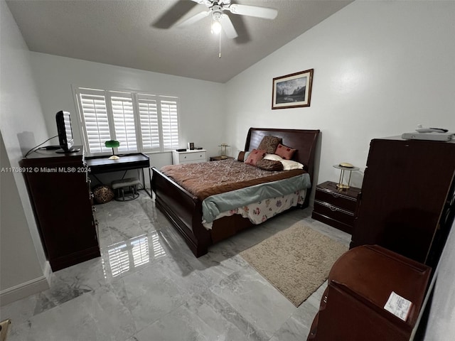 bedroom featuring ceiling fan, a textured ceiling, and vaulted ceiling