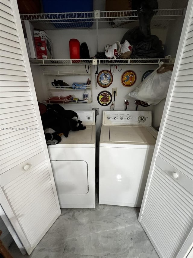 laundry room with washer and clothes dryer